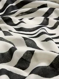 a close up of a black and white zebra print fabric